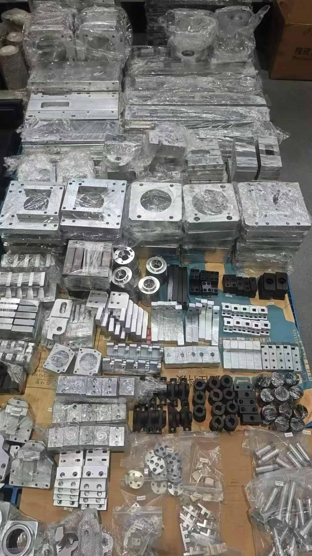 Custom machined parts packed and organized for shipment